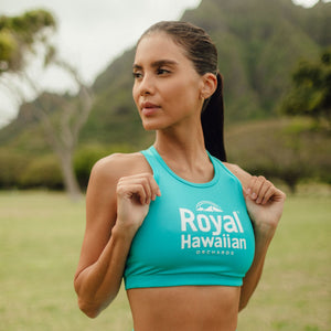 woman wearing blue royal hawaiian orchards yoga top